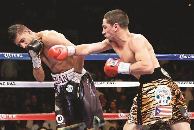 Danny Garcia shocks Khan to unify WBA and WBC titles