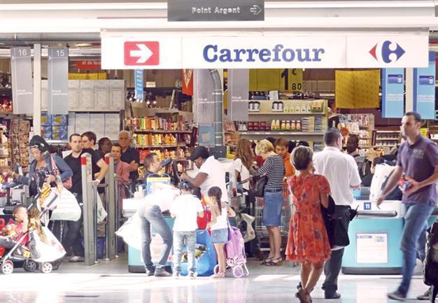 French retailer Carrefour to reduce staff and wages