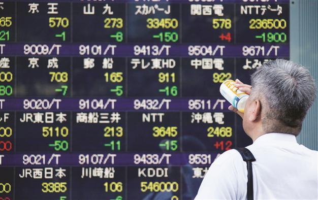 Japan holds steady on rates, policy