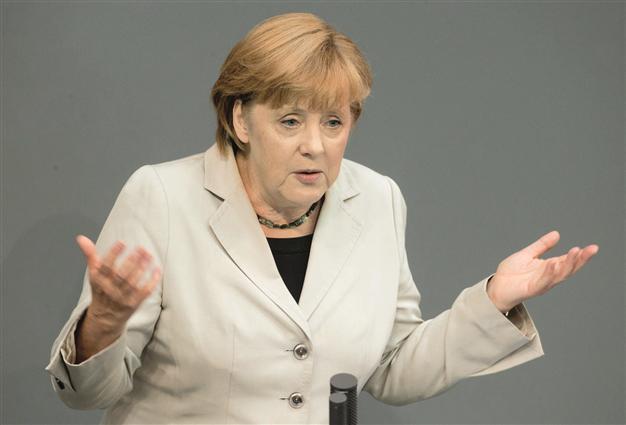 Merkel praises migrants’ role in German progress