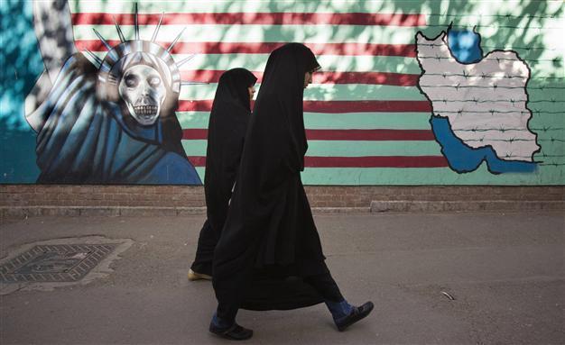 Iranian girls beat up cleric after he warns them to cover up
