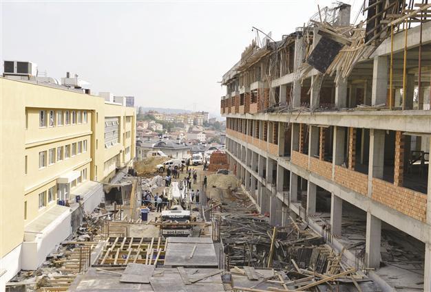 Collapse at construction site kills 2, injures 1