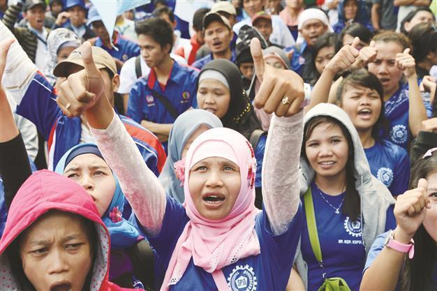 Workers in Indonesia strike for higher wages