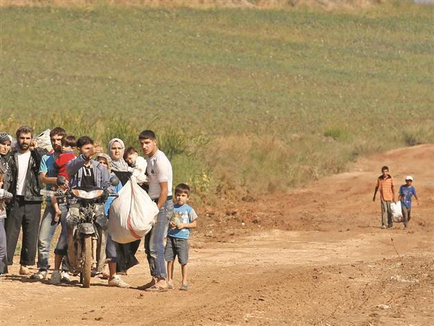 Turkey keeps its door open for Syrian influx