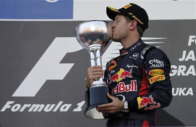 Vettel win puts title on knife-edge