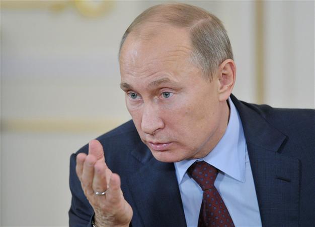 Putin backs secular values after school bans hijabs
