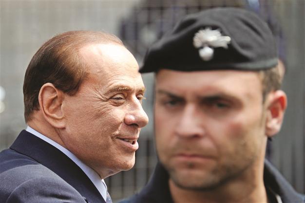 Berlusconis sentence cut to one year
