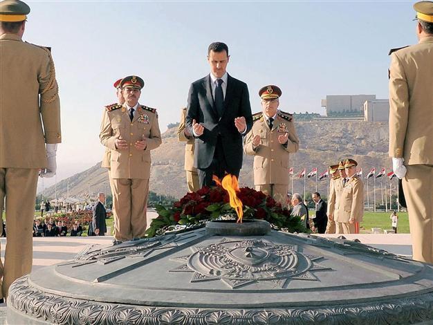 Assad rejects exile, says will live and die in Syria