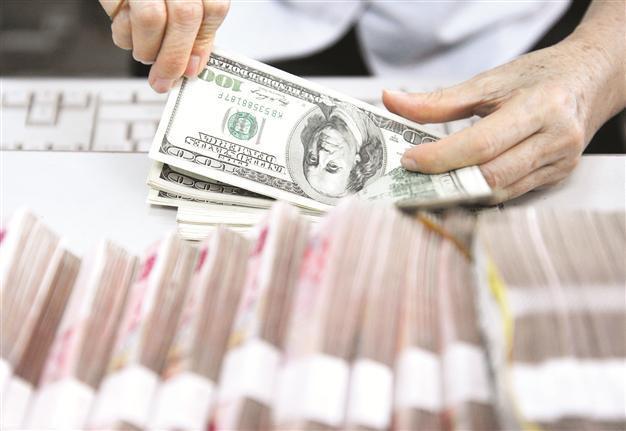 Yuan hits record high against greenback