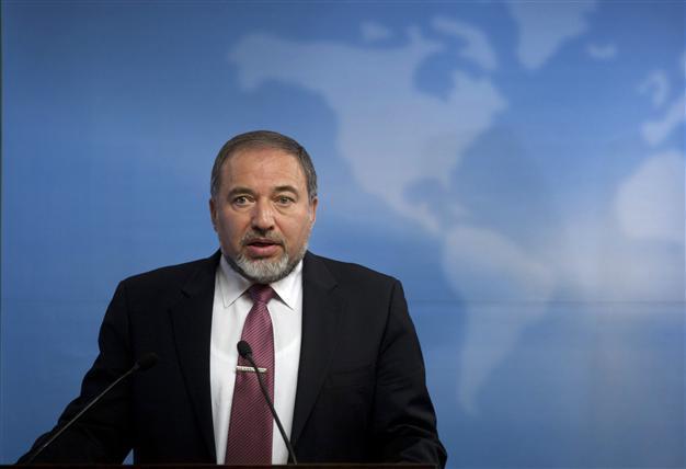 Israeli FM charged with breach of trust