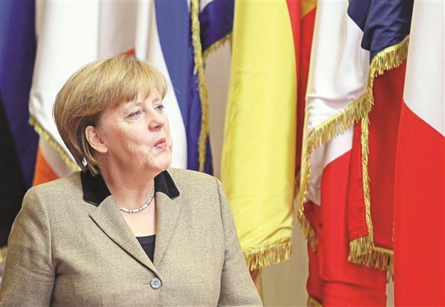 Work hard to keep welfare, says Merkel