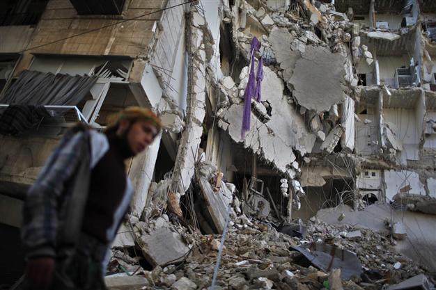 Syria troops press Homs offensive, 23 children die