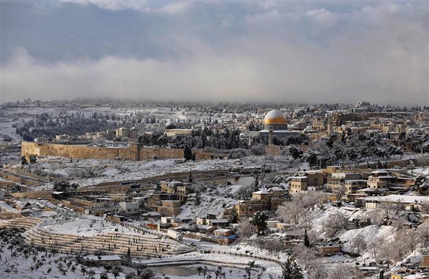 Heavy snowfall turns Holy City white