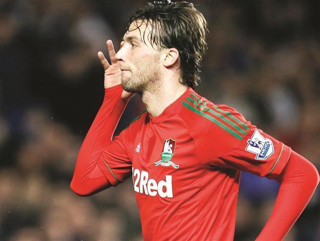 Manager Laudrup confident Michu won’t fly Swans’ nest
