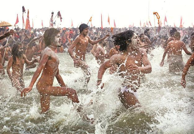 Hindus run in Ganges River to cleanse sins
