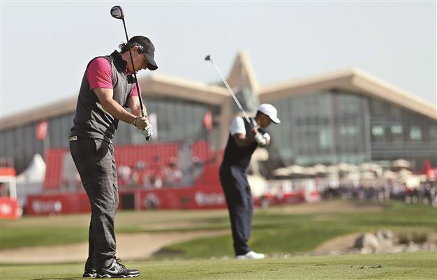 McIlroy, Woods make slow starts to Abu Dhabi event