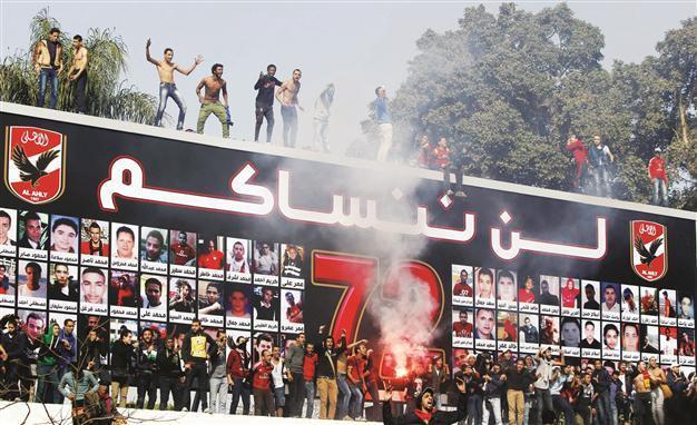 Morsi under pressure as football brawls rock Egypt