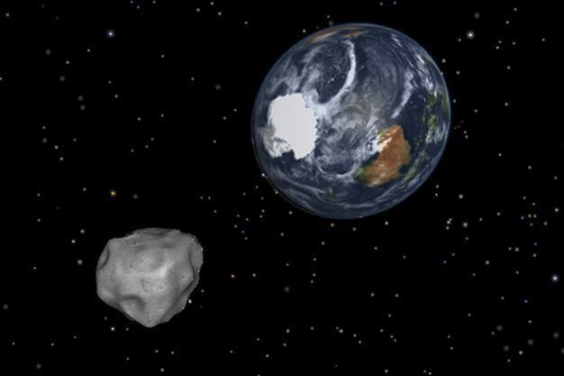 Asteroid whizzes past Earth