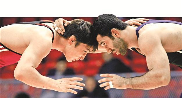 Political foes join forces together to keep wrestling in Olympic Games