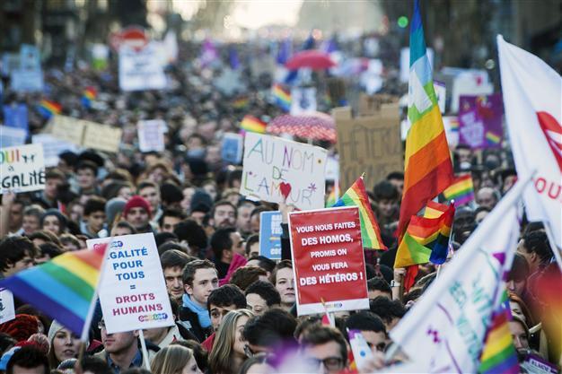 Gays celebrate France marriage, adoption breakthrough