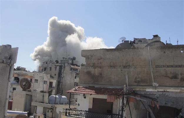 Jets bomb Homs district, Qaeda claims killing Syrian troops