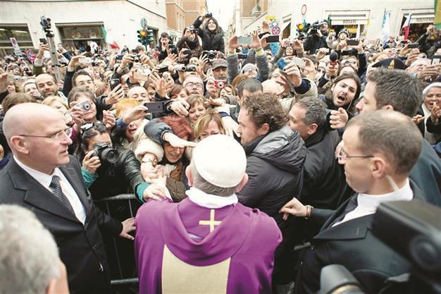 ‘Ordinary’ pope wades into crowd