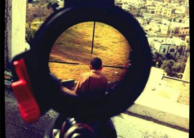 Israeli soldier’s photo of Palestinian boy in crosshairs stirs debate