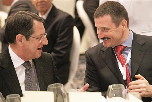 Greek Cyprus offers passport to big foreign losers in banks