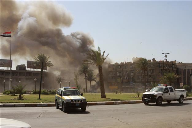 Blasts, clashes kill at least 25 in central Baghdad