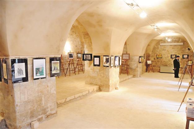 Aydın Doğan cartoons on display in Mardin