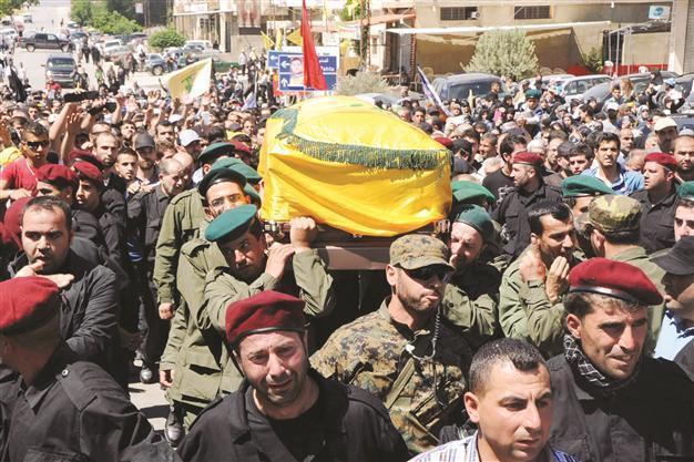 Lebanon leader cautions Hezbollah over Syria role