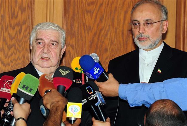 Syria to attend Geneva peace conference, FM says