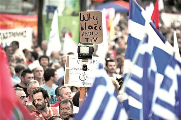 Greek court orders state TV channel back on air