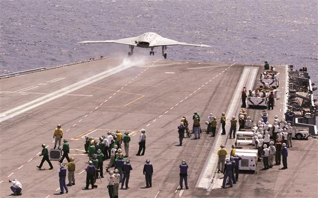 US drone makes historic landing on carrier deck
