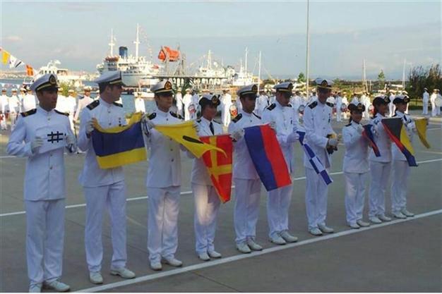 Students protest minister with nautical flags spelling out Gezi protest slogan