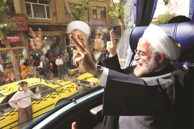 Iran’s Rouhani signals softer line on liberties
