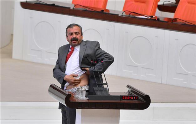 BDP deputy shows bruise on body in Parliament caused by tear gas canister during Gezi protests