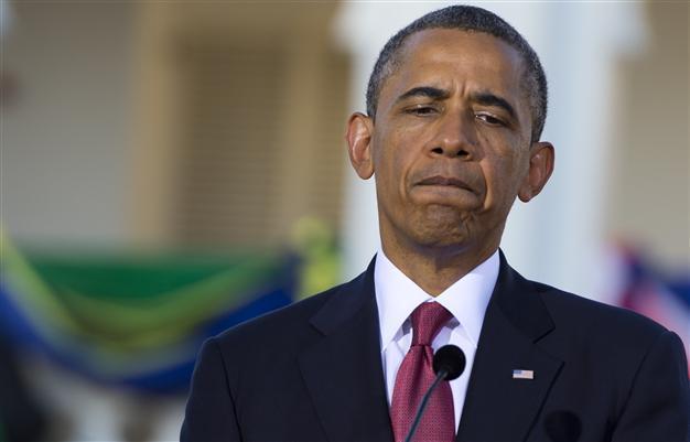 Obama urges calm in Zimmerman case as thousands protest