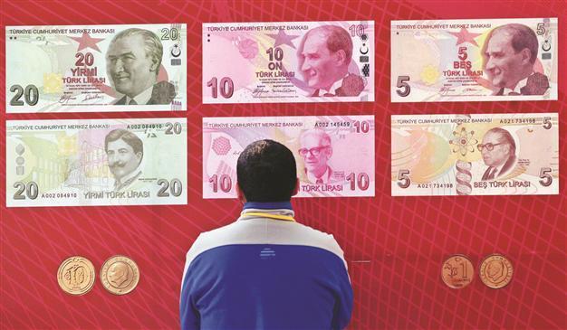 Turkeys central bank signals for rate hike after lira slide