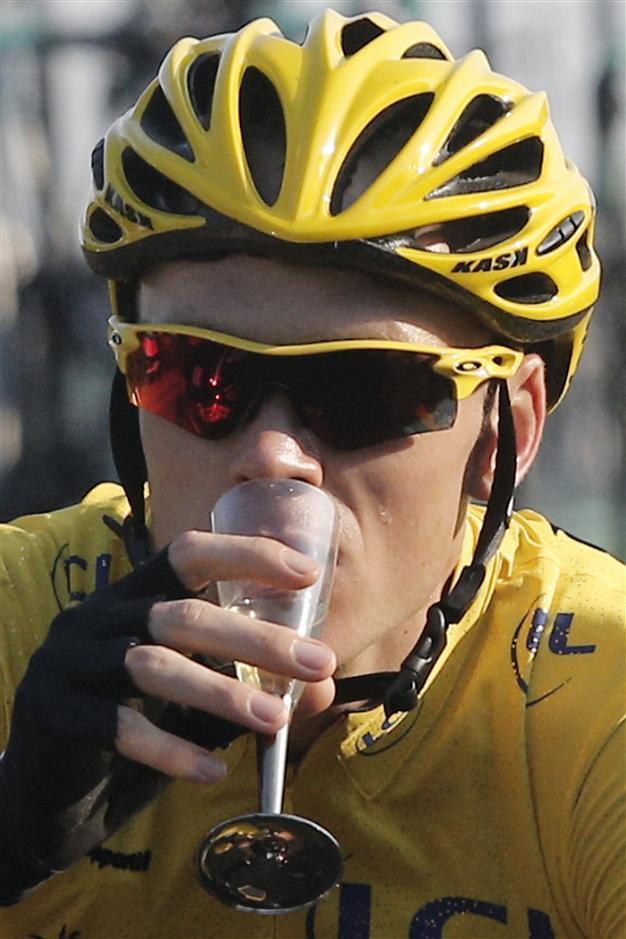 Britains Chris Froome rides to victory in 100th Tour de France