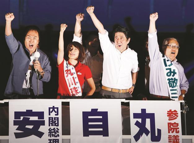 Japan’s Abe wins elections, calls for economic reform
