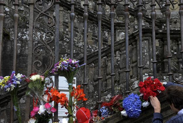 Spain mourns crash victims as train driver charged