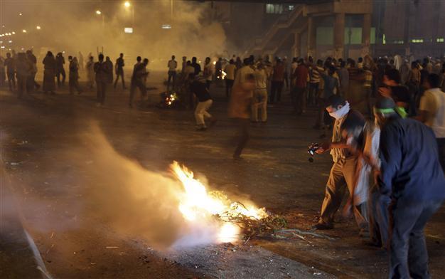 Scores killed in pro-Morsi demo in Egypt, as parties give conflicted reports on death toll