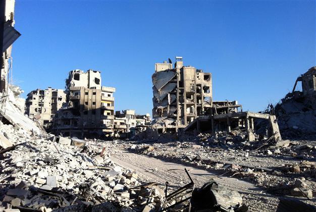 Syria army retakes key Homs rebel district: state TV