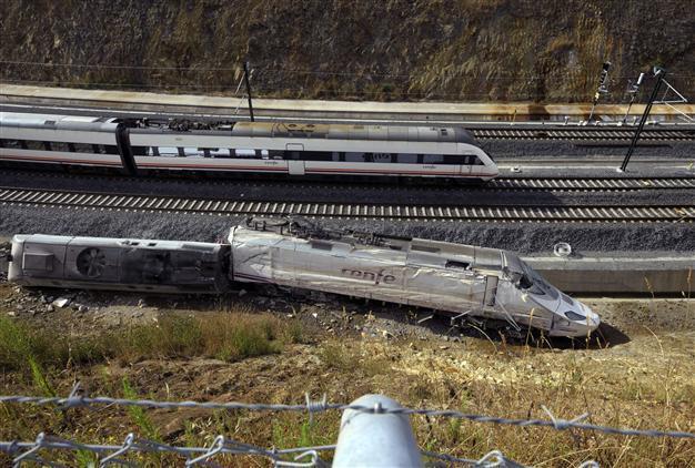 Police detain Spain train crash driver as suspect