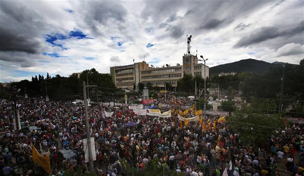 Greeks strike over state TV closure, PM offers talks
