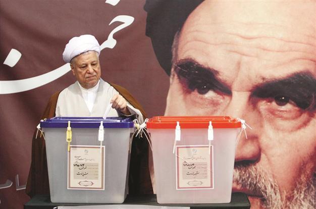 Iran votes for president, Khamanei slams doubts