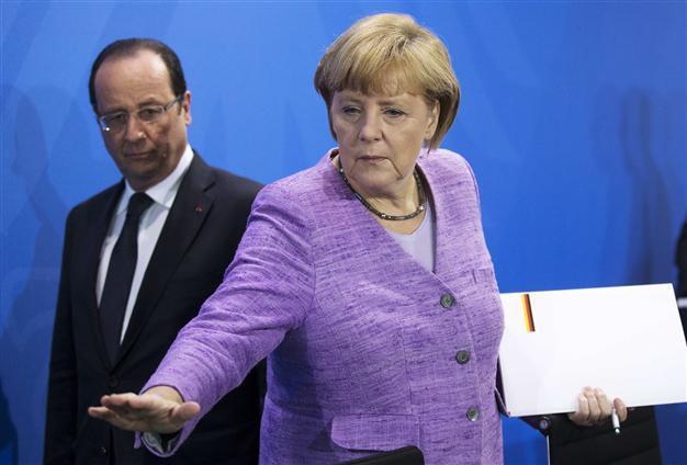 Hollande, Merkel call for urgent Europe talks on Egypt