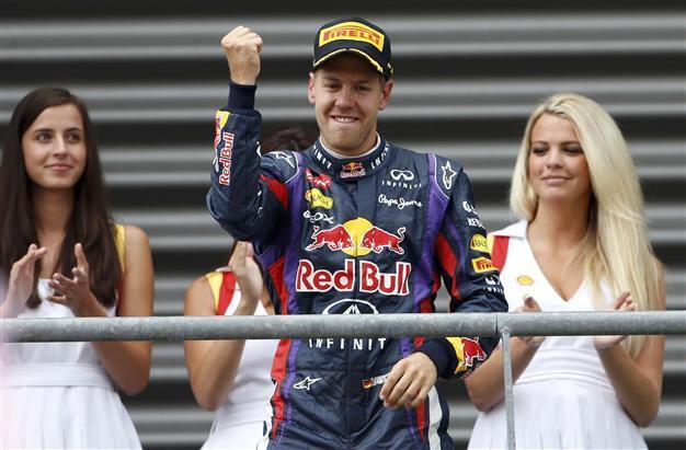 Vettel storms to victory, extends lead in title race