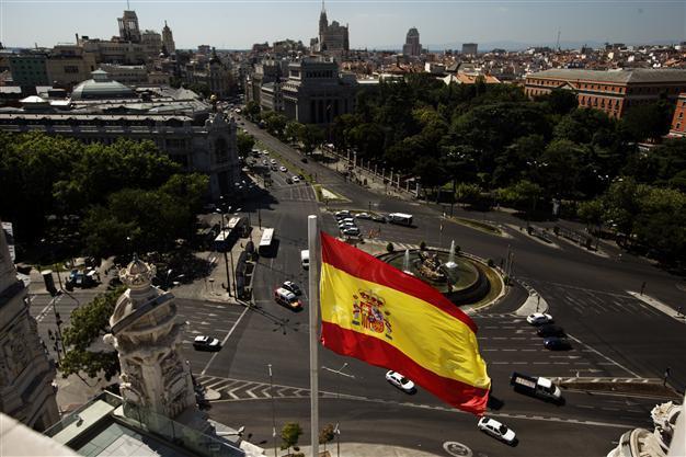 Spain says 2-year recession eased by growing exports